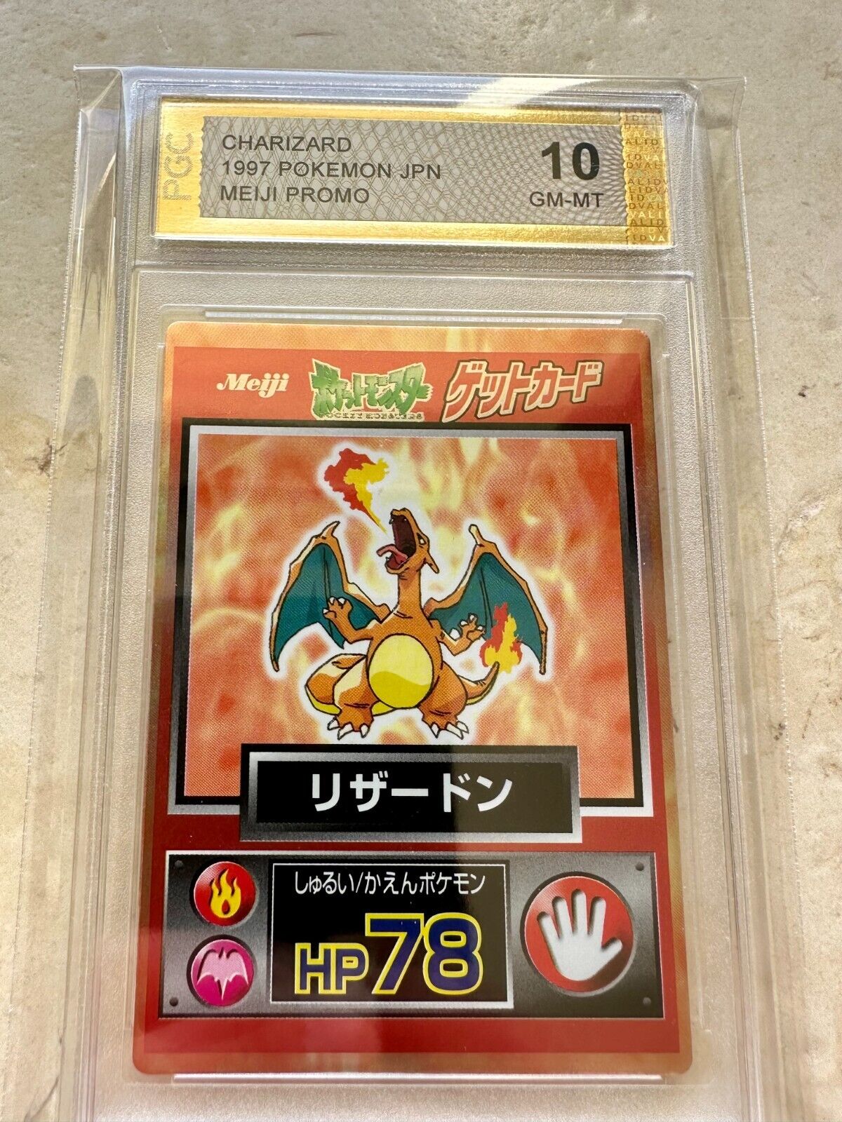 CHARIZARD 1997 MEIJI PGC 10 CHOCOLATE GET 006 PSA JAPANESE POKEMON